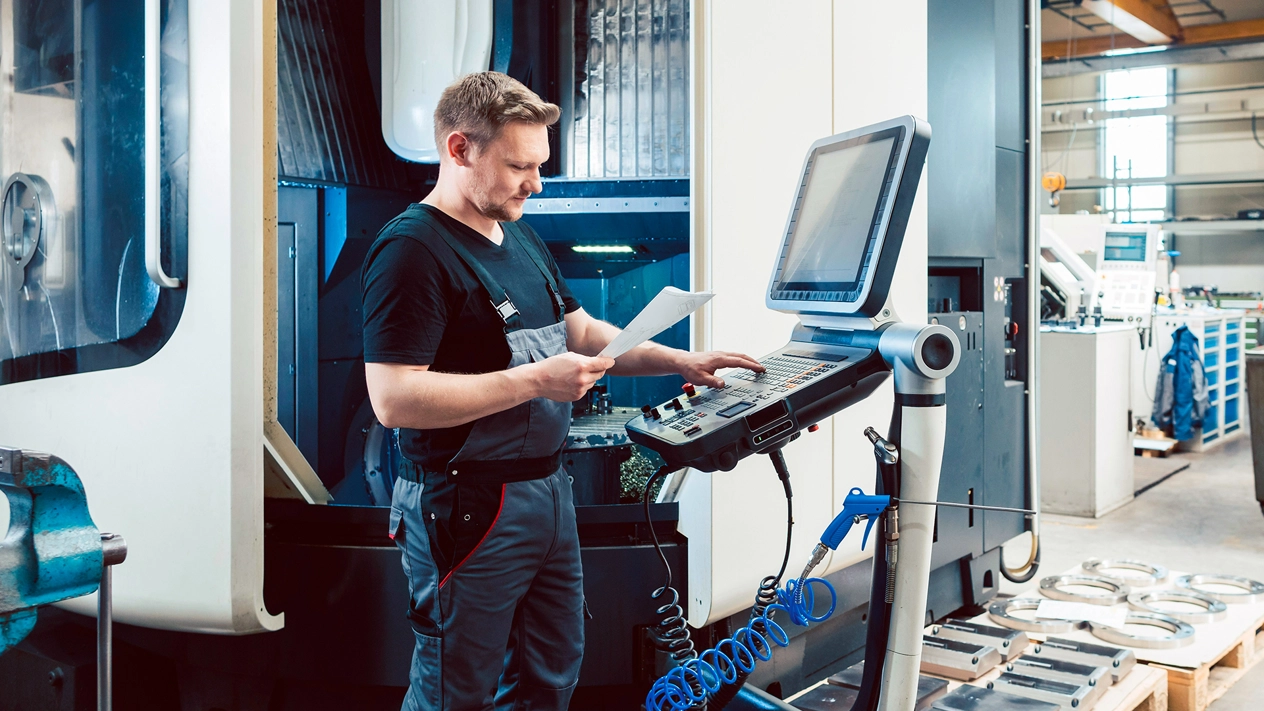 Engineer inputting data in a smart factory